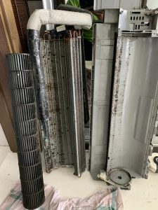 Dirty aircon evaporator coil and blower removed for chemical wash and overhaul service