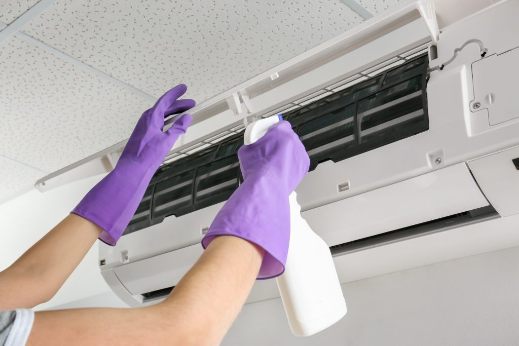 Professional aircon general servicing and antibacterial spray treatment for an indoor fan coil unit